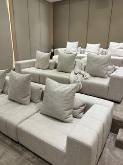 Tiered home theater sofas with throw pillows