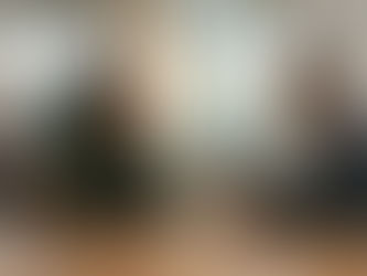 "A female leader practicing active listening and behavioral awareness during a meeting with a senior executive in a corporate office."