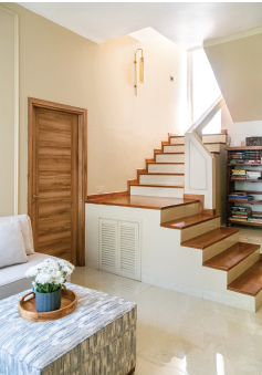 Multi-functional guest bedroom and home office with concealed projector system and custom furniture.