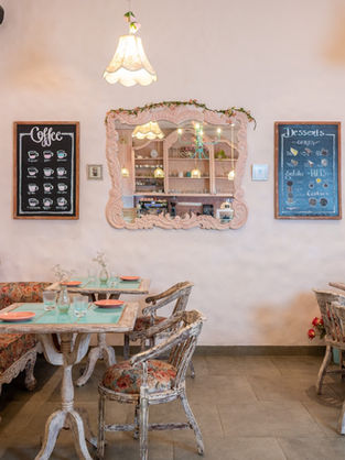 outique hospitality interior featuring exposed brick and hand-painted rose murals