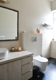 Modern bathroom interior with bespoke vanity, designer fittings, and elegant material palette.
