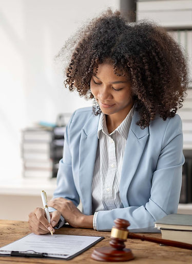 woman-lawyer-signing-legal-document-at-desk-2026-01-07-00-58-34-utc.jpg