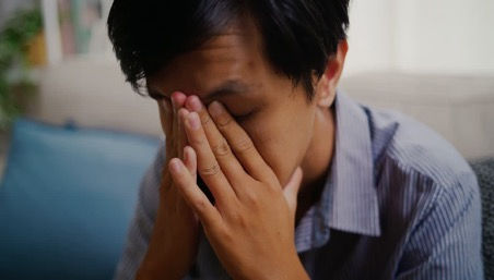 Man feeling overwhelmed when thinking about his life