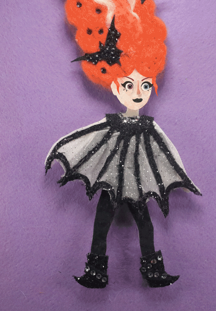 This is my character willow dressed in a spooky style, with her hair up high and a an outfit that is similar to cobwebs.