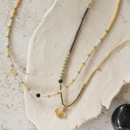 Thumbnail: A Beautiful Story Adventurous Necklace + Bracelet available in Black Onyx + Gold from Iris Lifestyle Cambridge UK