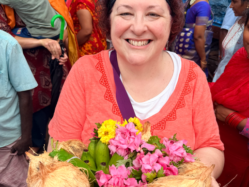 Melissa holding an offering of coconuts at the Surya Temple