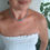 Thumbnail: Woman wearing a white dress and turquoise bead necklace Thetistreasures.