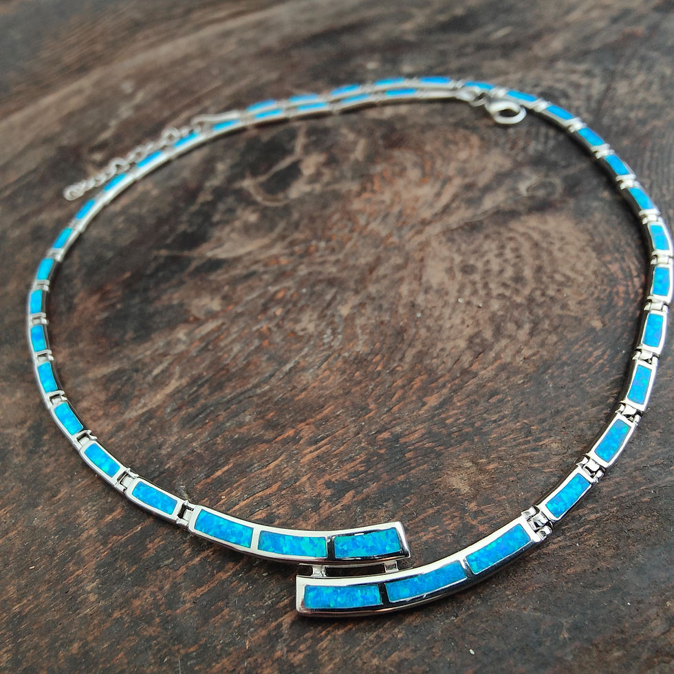 Silver necklace with turquoise stones, close-up on brown wooden background, Thetistreasures