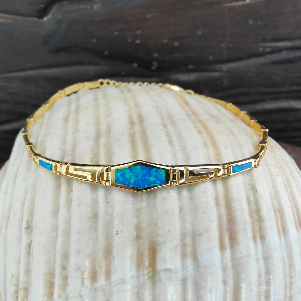 Μικρογραφία: Gold bracelet with blue opal center stone, seashell background. Thetistreasures