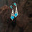 Thumbnail: Elegant turquoise Olive Leaf Green Opal, 925 Silver & Zircon earrings on wooden surface.