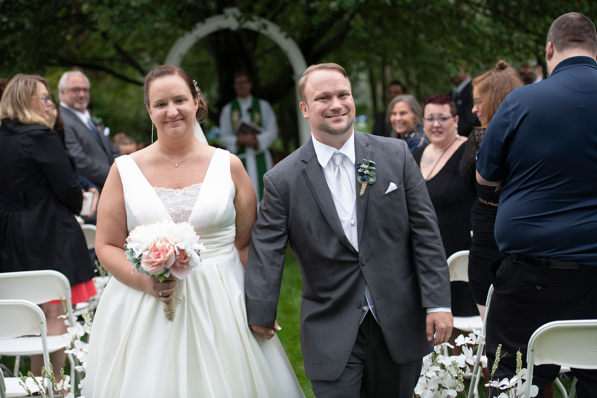 Happy couple walking down the aisle