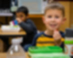 Smiling students at Trinity Lutheran Church, School, & Childcare enjoying lunch together.
