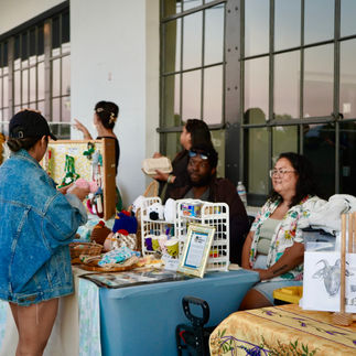 vendor engages with customer at the alameda night market