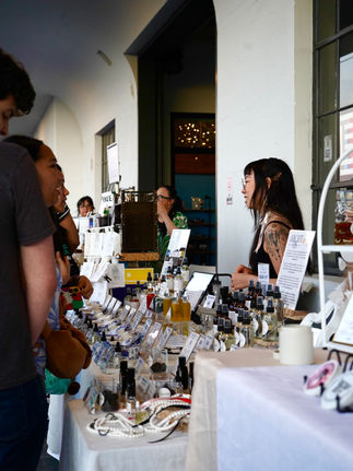 a vendor engaging with customers as they browse