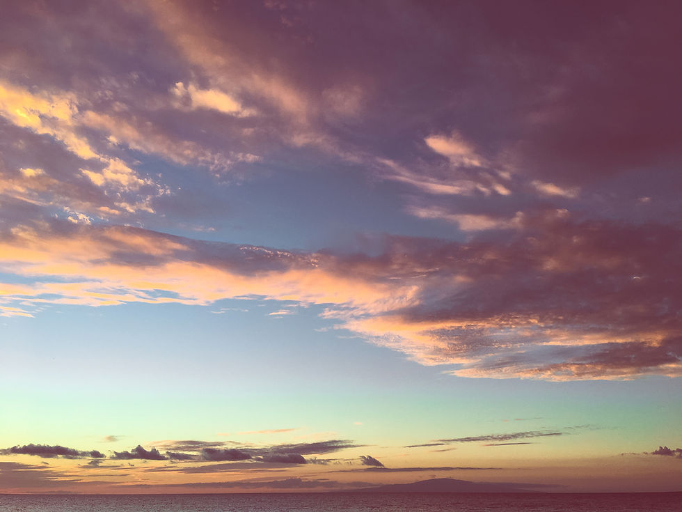 Blue and pink skies during a late summer sunset, clouds soft across the horizon, capturing the slow magic of the season.