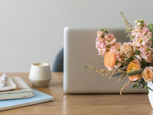 Coffee and laptop on a desk