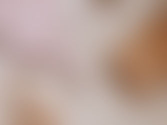 Flat lay of workout essentials—yoga block, water bottle, and workout clothes neatly arranged on a wooden floor, symbolizing mindful movement and self-care.