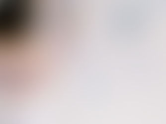 Woman placing photo on wall for mood board