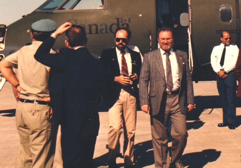 Alas, I could not find a photo of the legend-worthy incident recounted below, but here is a shot of the two principals involved: me on the left facing the camera, and beside me Dave Wenger, the Mount Forest perpetrator, as we disembarked from a Canadian Forces plane at the Nicosia airport in Cyprus.