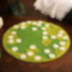 Detail of green textile border and white daisy flowers on Spring Meadow Sisal Cat Mat