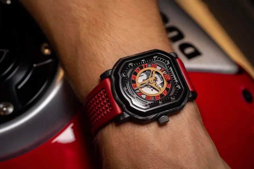Marking the 30th anniversary of the Ducati 916 motorbike, Gerald Charles releases a limited edition masterpiece. The watch combines top-of-the-range engineering with bold styling. Its stylish wrist watch beauty lies in its ultra-light forged carbon case. The skeletonized dial showcases the detailed movement, which features a jumping-hour complication. Taking cues from the Ducati's three-spoke rear wheel, the design is bold and distinctive. Available in just 250 pieces globally, it is a collector's item. It and is ideal for speed enthusiasts, precision lovers, and exclusivity seekers.