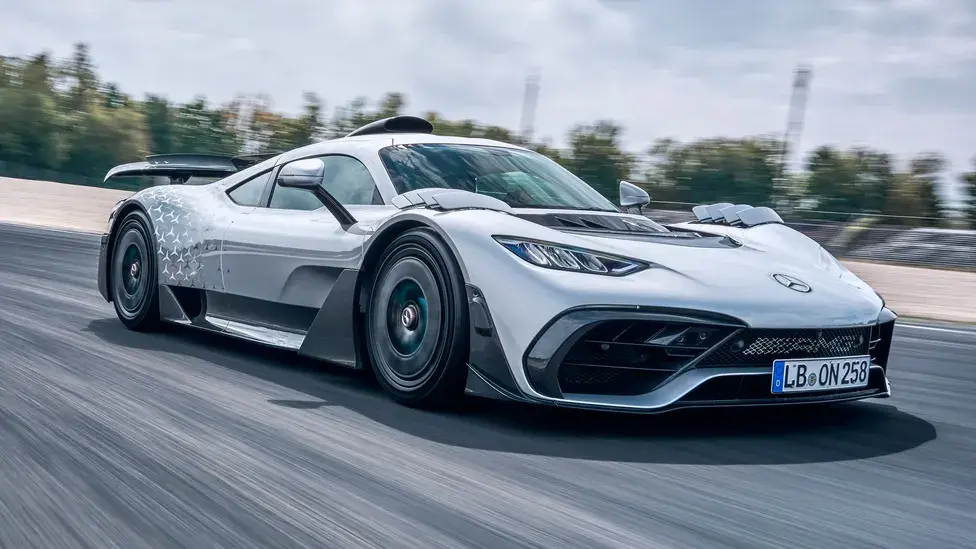The Mercedes-AMG One utilizes Formula One technology on the road. It features a 1.6-litre V6 hybrid engine, similar to those used in F1 cars, with a total output of 1049bhp. This arrangement enables the car to reach a top speed of 219 mph. The combination of superior aerodynamics and a lightweight construction results in great handling and performance.