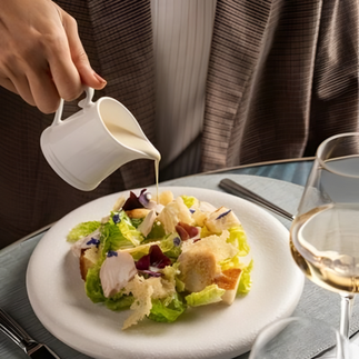 he cafe imports raw materials such as tomatoes and olive oil sourced straight from Italy to maintain the food quality. Begin with the Armani Caesar Salad, an innovative version of the Caesar salad that comes with sous-vide chicken and almonds.