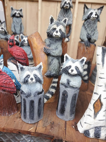 Chainsaw carved racoons