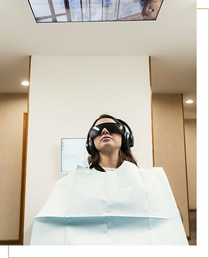 Patient relaxing with headphones and eye shade during a comfortable laser dental visit at Smile Theory in NJ