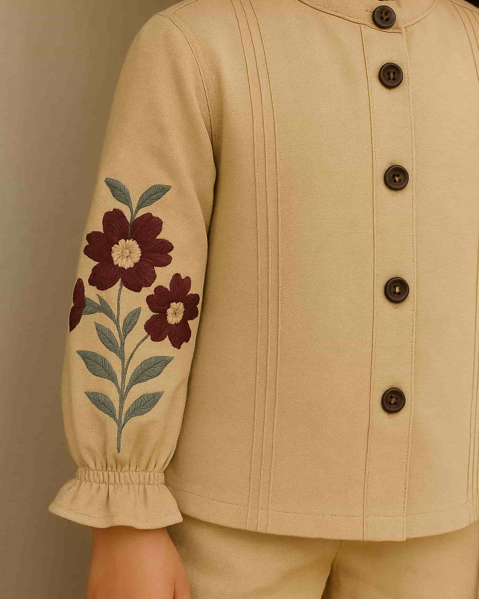 Thumbnail: Detailed shot of a beige co-ord set with embroidered sleeves