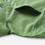 Thumbnail: A close-up of the chest pocket detail on the light green casual shirt, showing the flap and button.