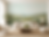 Wildflower wallpaper in a living room featuring rolling green hills, colorful meadow flowers, and soft watercolor skies.