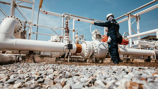 worker in white hard hat at facility