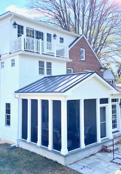 Three-level addition including screened porch, family room, kitchen, bath, library, attic, & more!