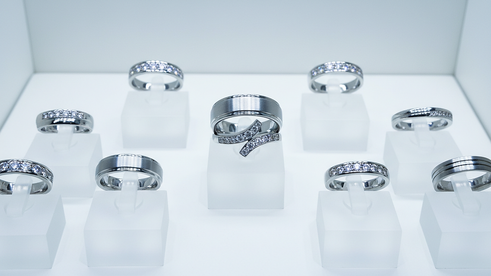 Eye-level view of a display case with various wedding rings