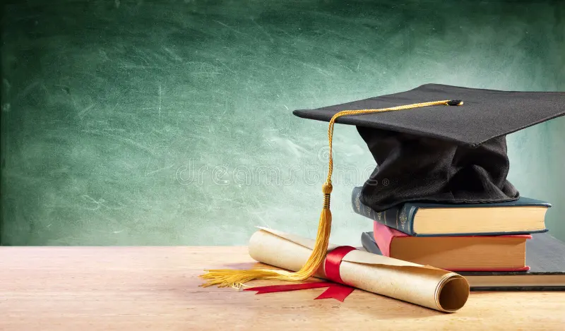 graduation-cap-diploma-table-books-150016685.webp