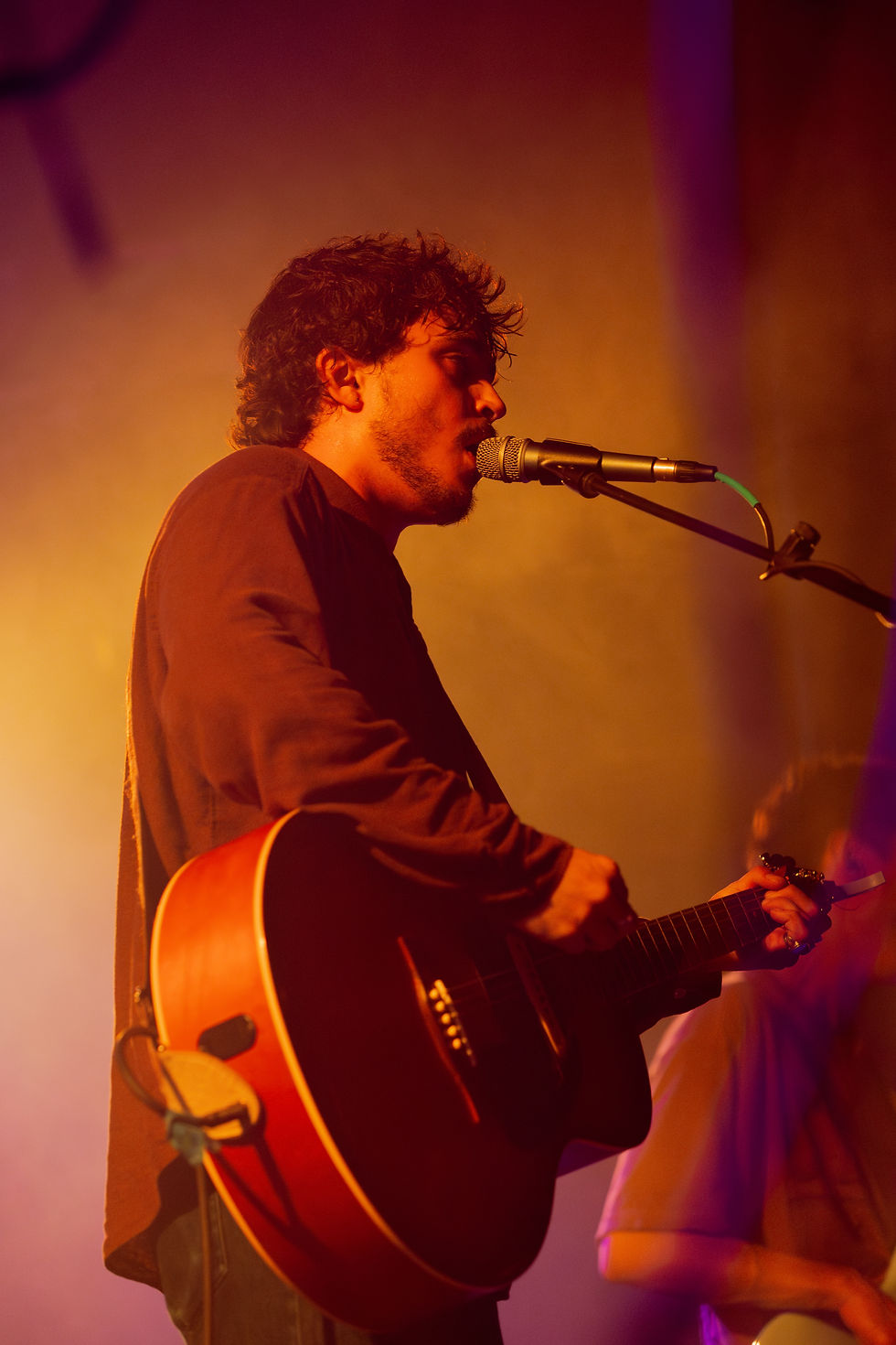 FRIKO vocalist/guitarist Niko Kapetan on acoustic guitar