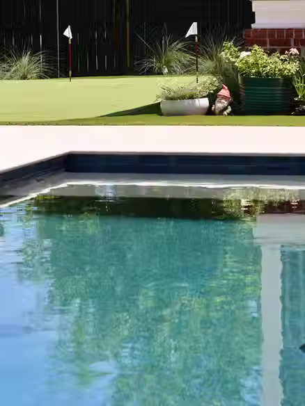 Complete backyard transformation with luxury pool.