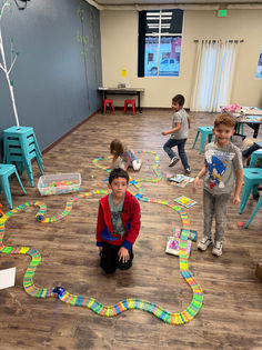 Students build a race track in their STEM Addventurers club.
