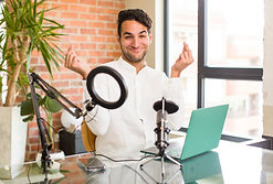 young hispanic man feeling happy, positive and successful, money concept and celebrating g