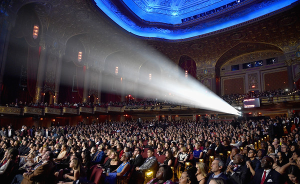 crowd sitting in a theater