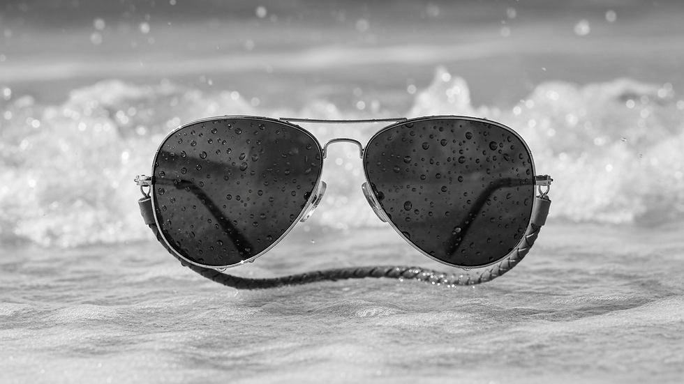 Close-up view of aviator sunglasses with metal frame and polarized lenses