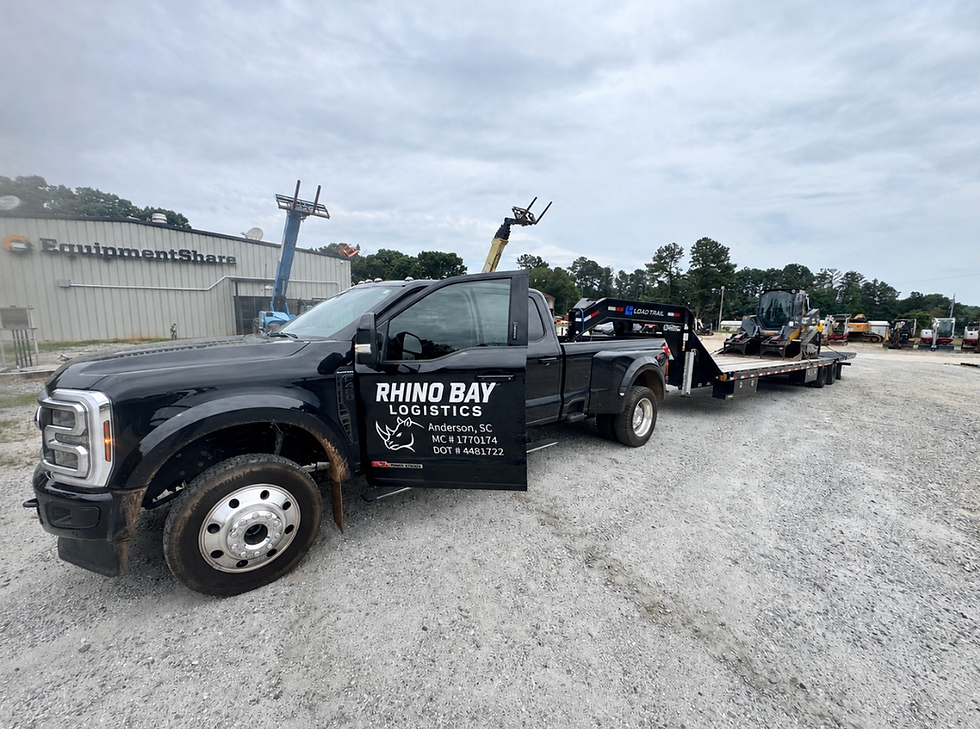 Hauling construction equipment using 40' gooseneck flatbed with hydraulic dovetail