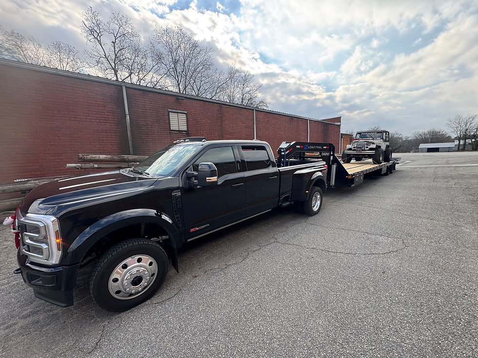 Vehicle transportation using 40' gooseneck flatbed with hydraulic dovetail