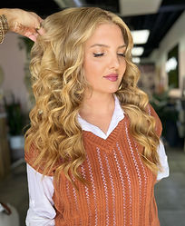 this is a photo of a lady with curled hair