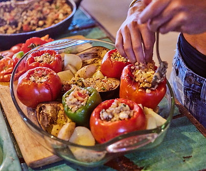 Greek traditional dish yemista prepared by a cook during a yoga retreat.