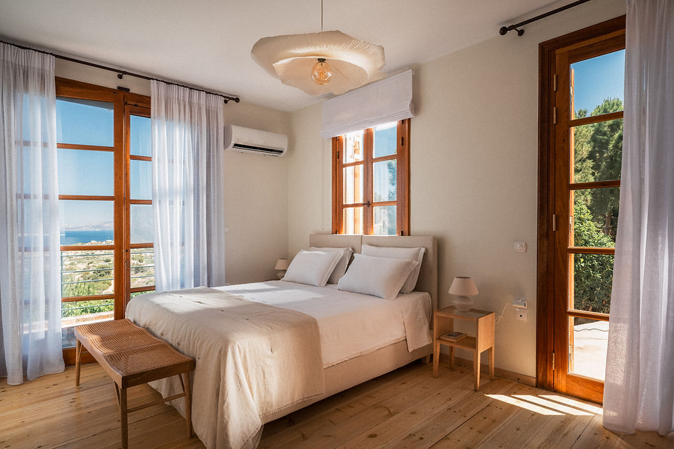 Spacious premium room with large windows, offering stunning sea views and direct terrace access at E