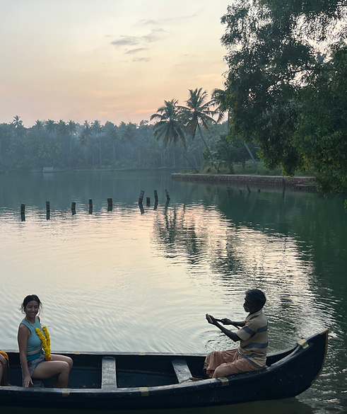 Girl on a fisherman boat at a lake in Kerala, India.