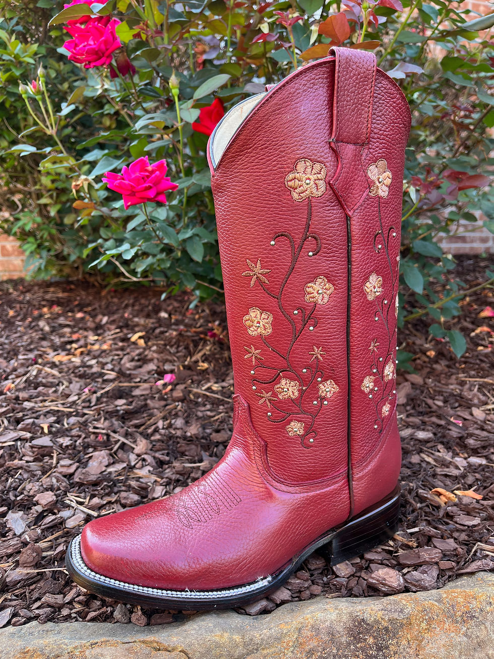 Thumbnail: side view of red boot on mulch