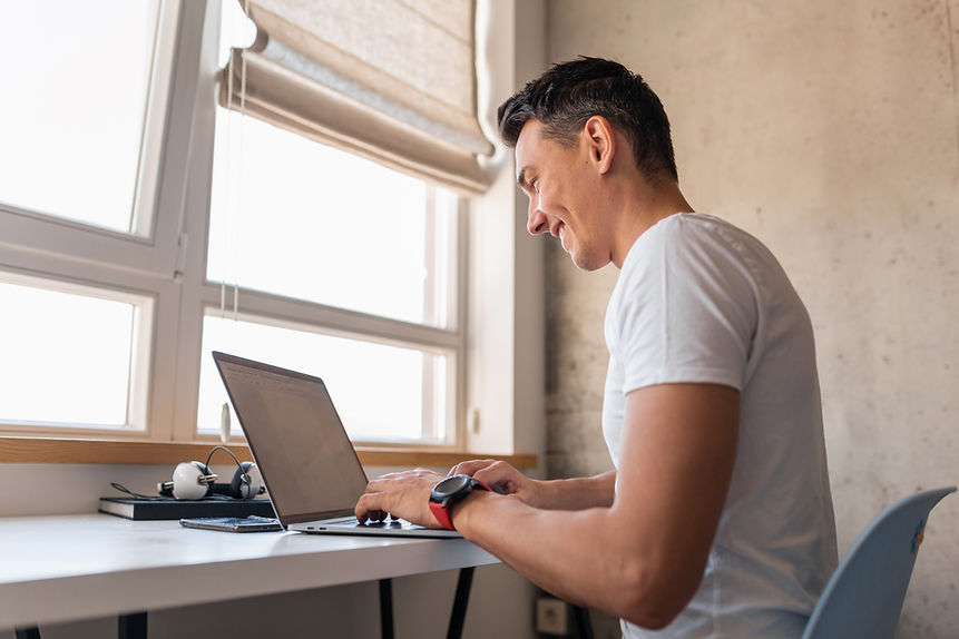 young-handsome-man-casual-outfit-sitting-table-working-laptop-freelancer-home.jpg